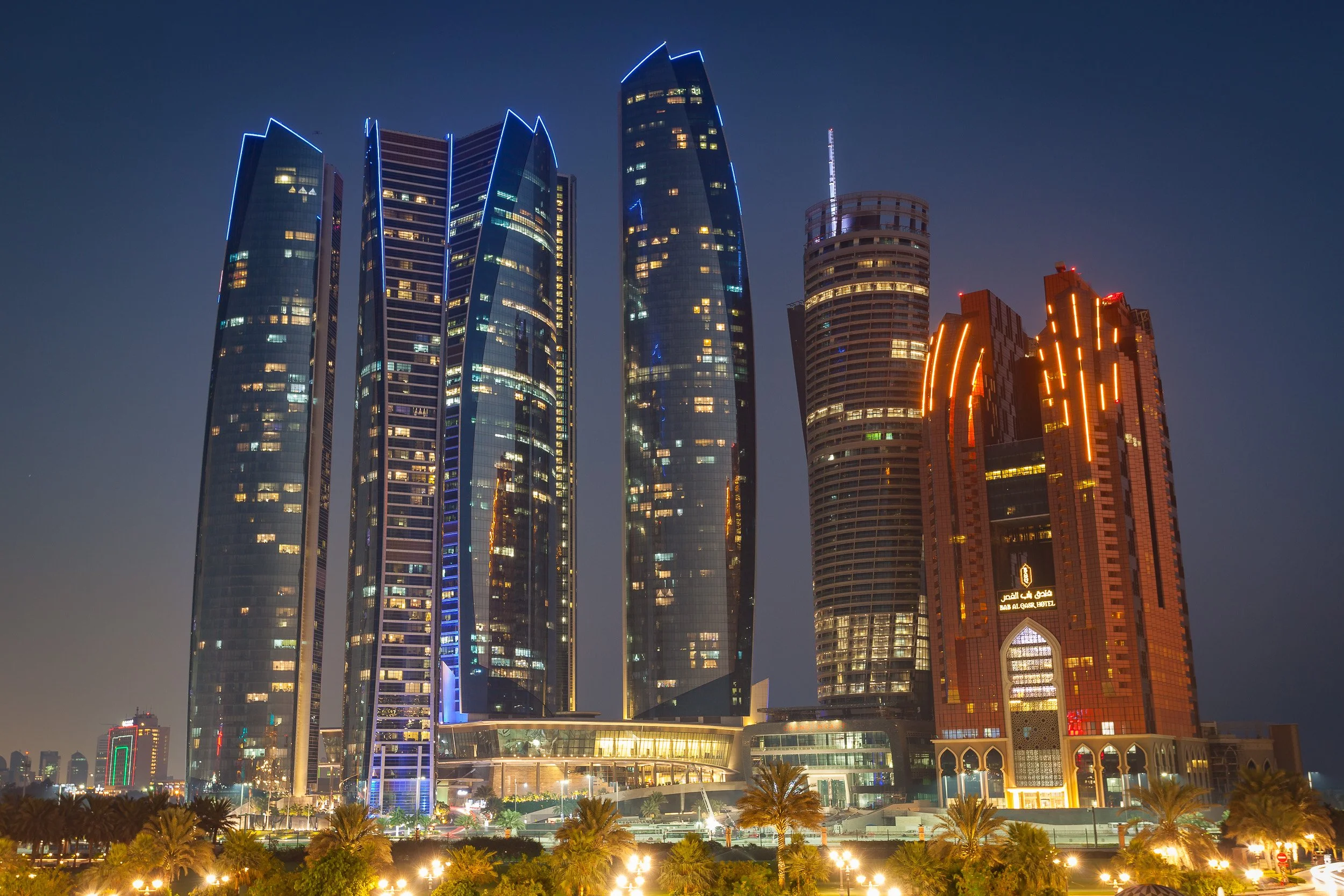 Etihad Towers and neighbouring high-rises lighting up the Abu Dhabi skyline.