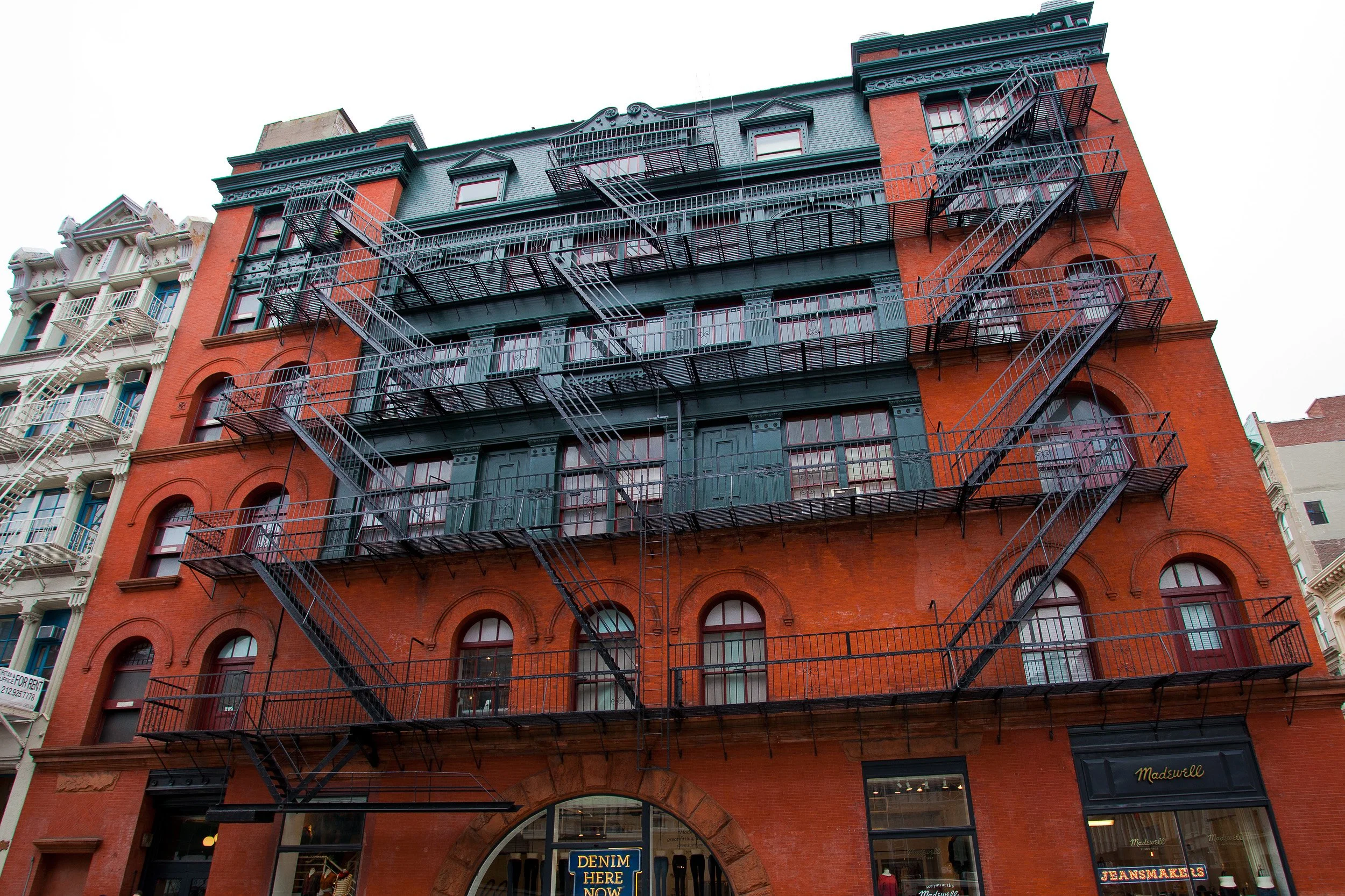Classic red-brick architecture and cast-iron fire escapes capturing the character of old New York.
