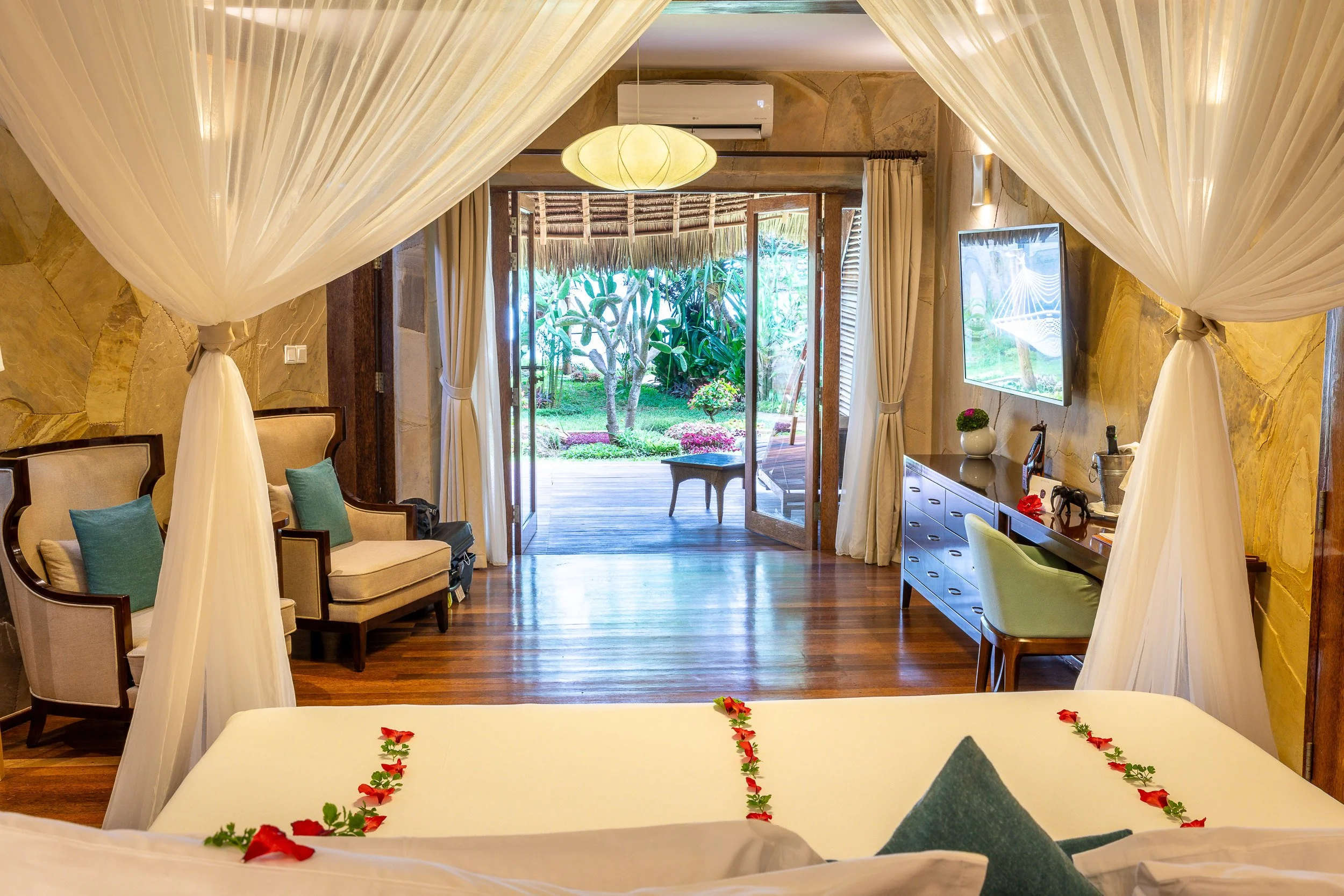 Our bungalow at Tulia Zanzibar Unique Beach Resort – private villa with thatched roof, shaded terrace and tropical garden just steps from the beach. Click the image for a short room tour.