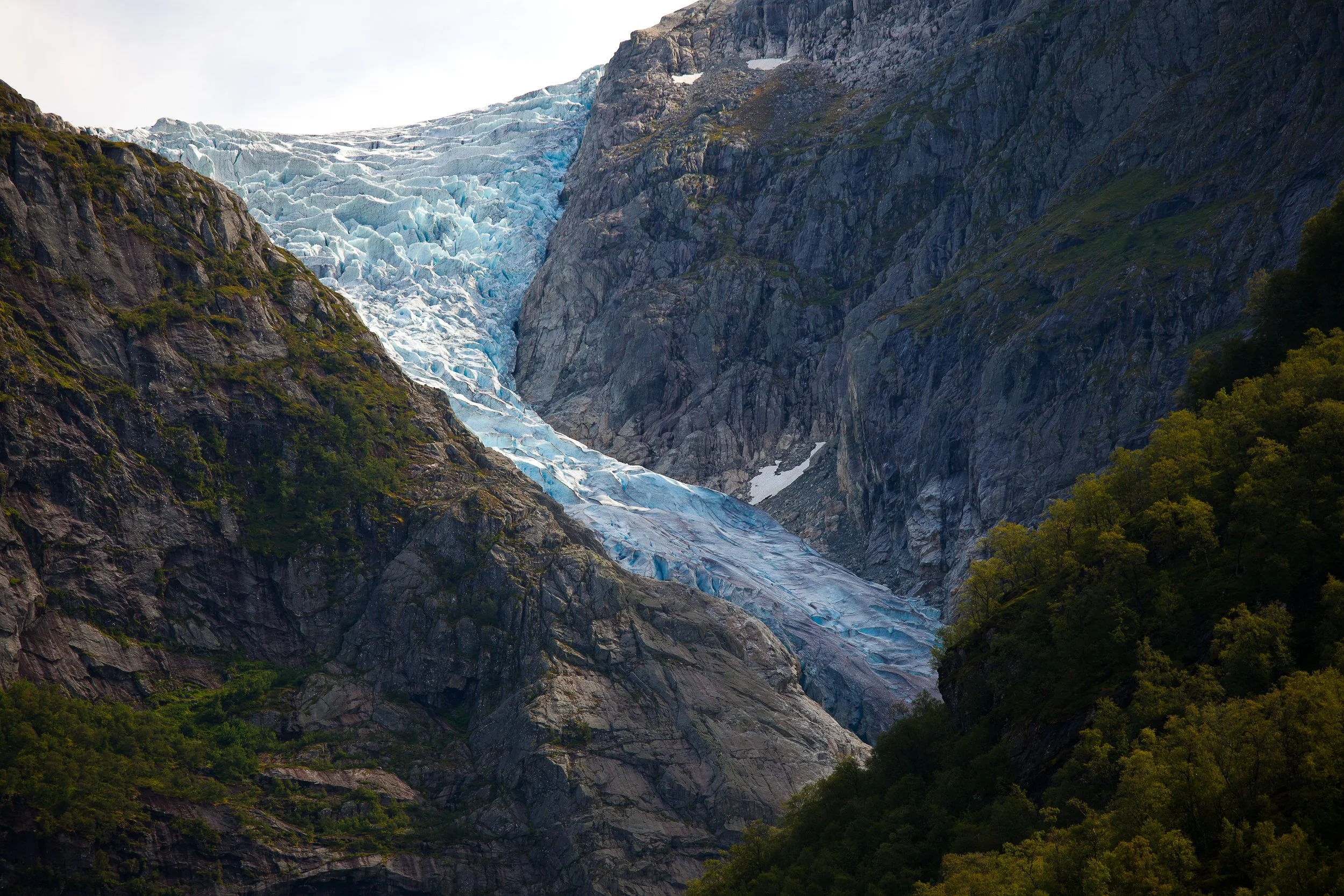 Bondhusbreen in Hardanger – a glacier arm of Folgefonna, where blue ice descends between steep rock walls above the valley.