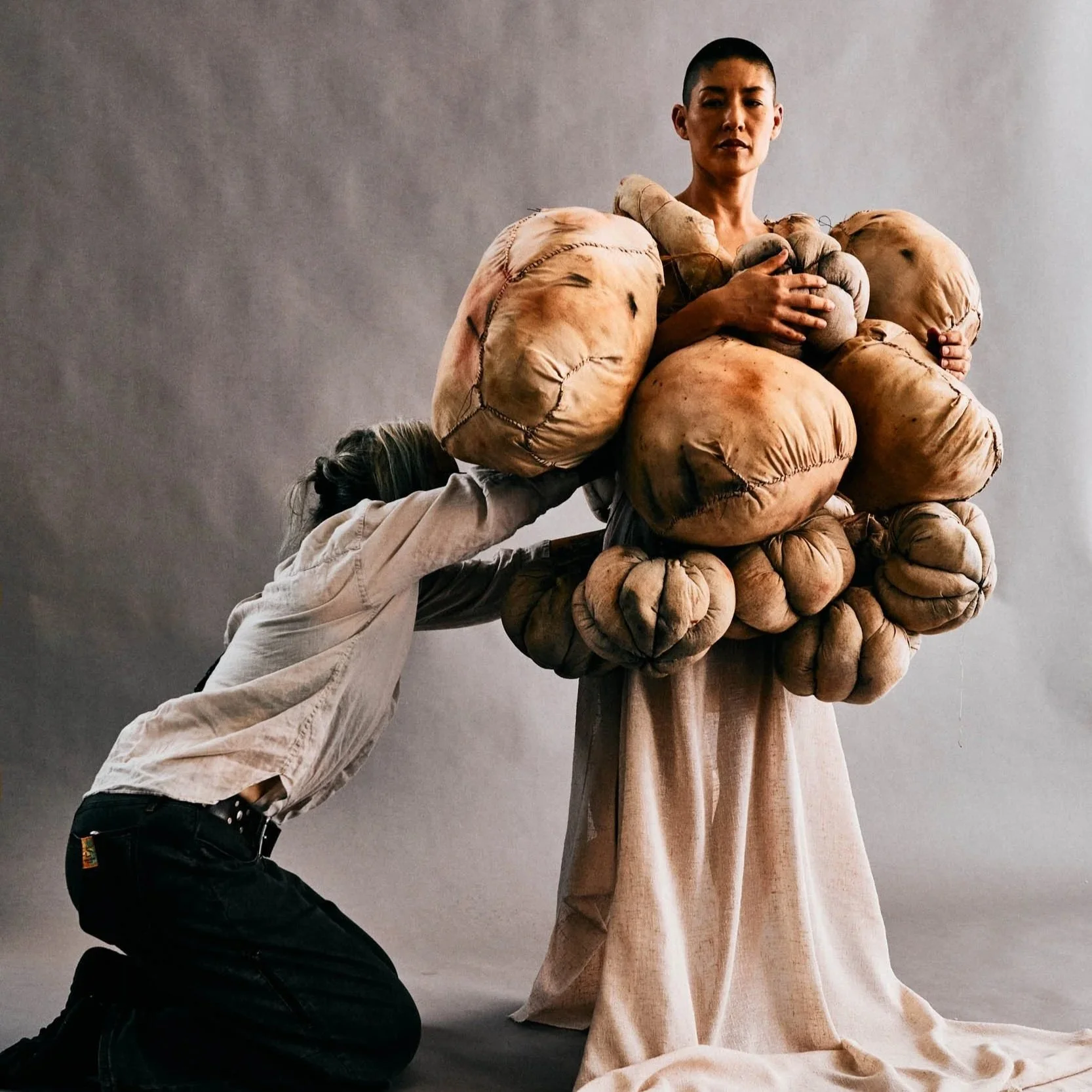 Artist Frankie Holt in studio in Downtown Los Angeles Fashion District with dancer, model preparing for shoot