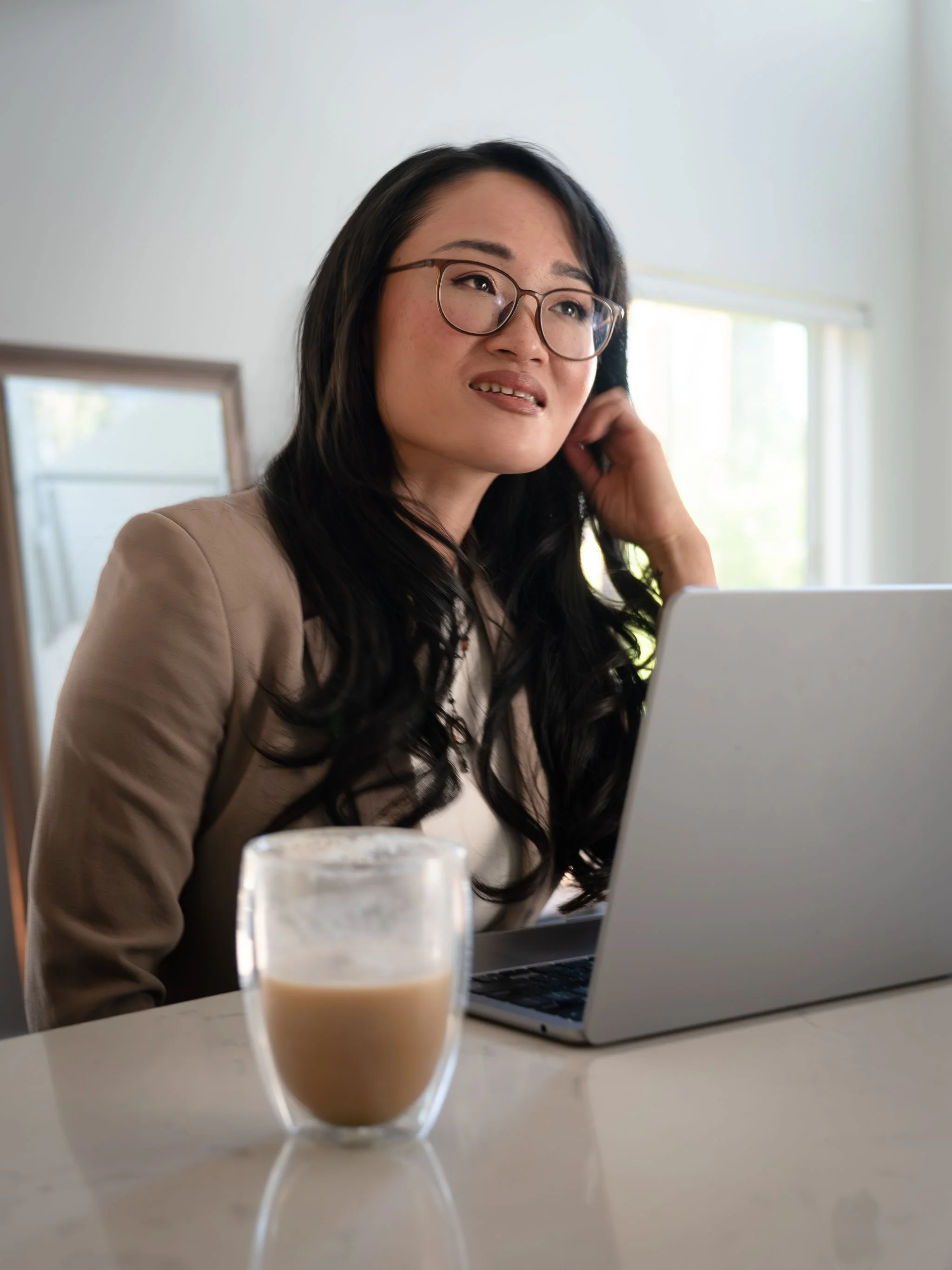 Elizabeth Huang having coffee and working