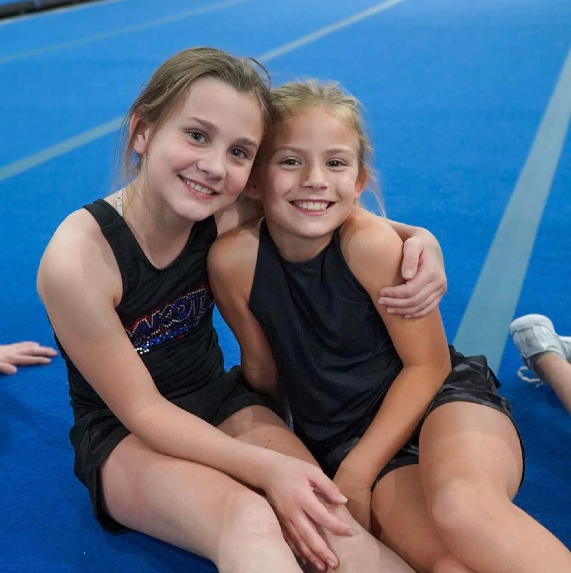 Dakota Spirit Students sitting on the blue mat.