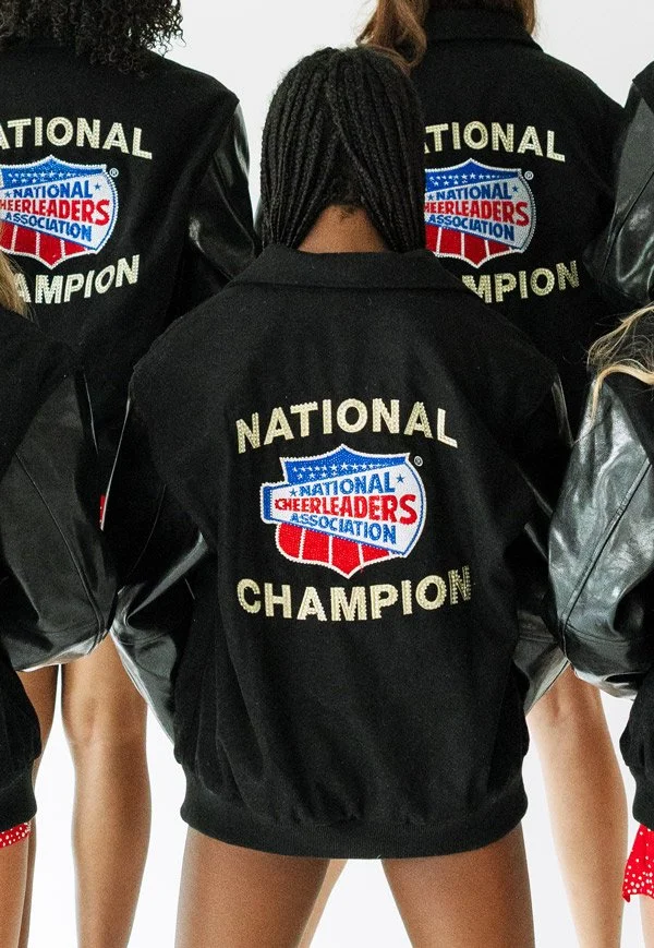 Dakota Spirit athletes showcasing their NCA National Championship Jackets.