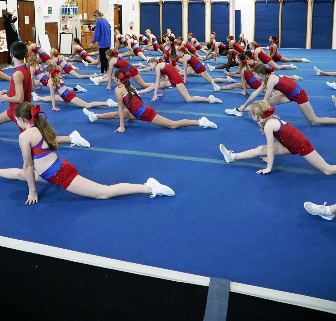 Dakota spirit athletes doing warm up stretches at the facility.