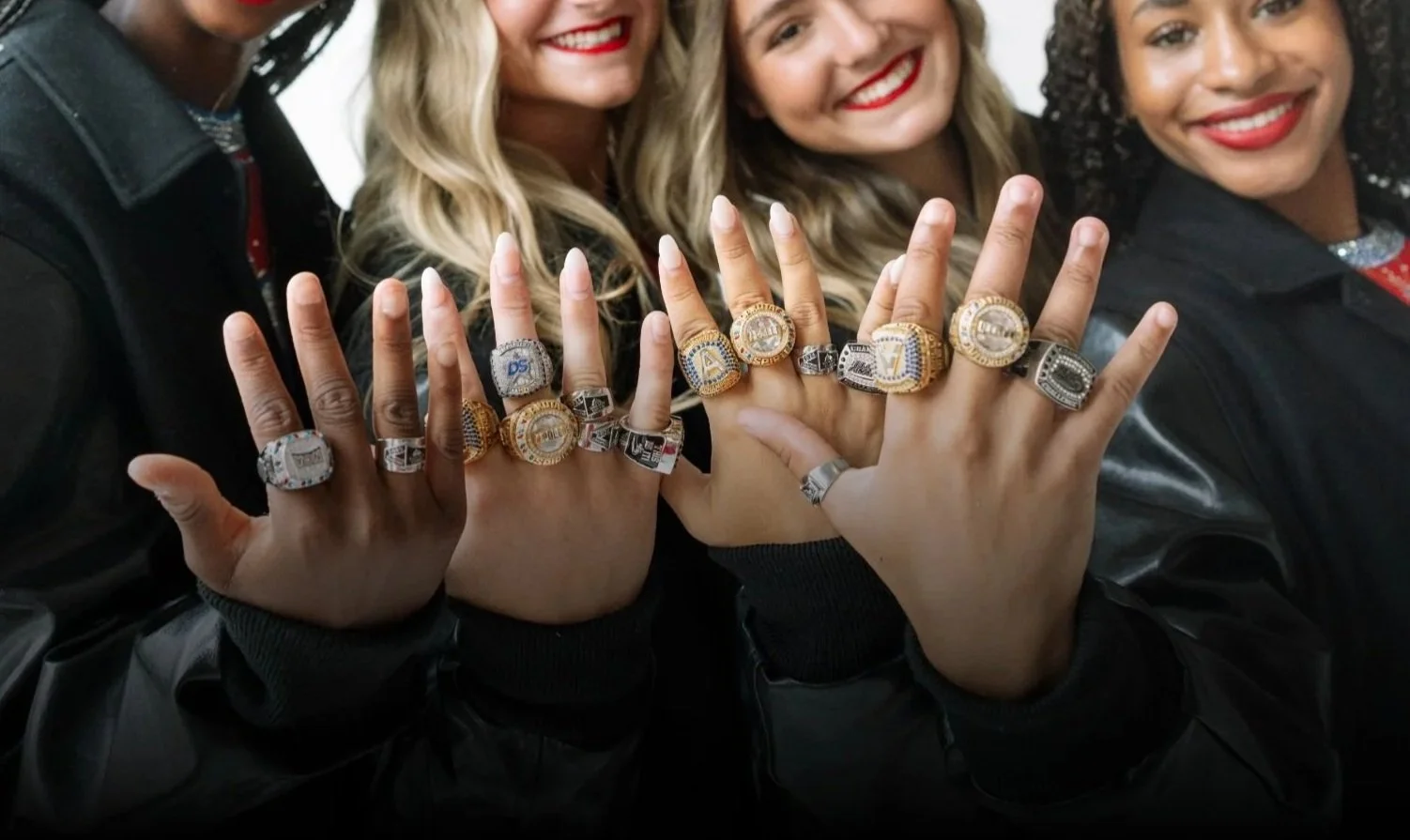 4 Dakota Spirit showcasing their championship rings.