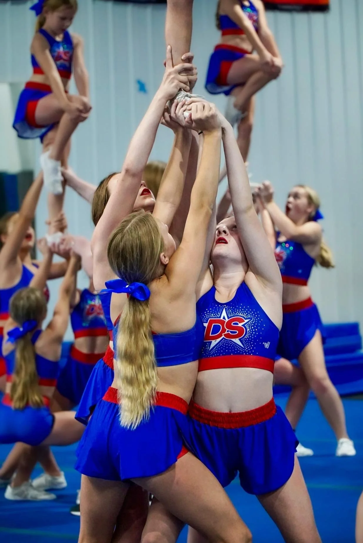 Dakota Spirit athletes performing a lift during practice.