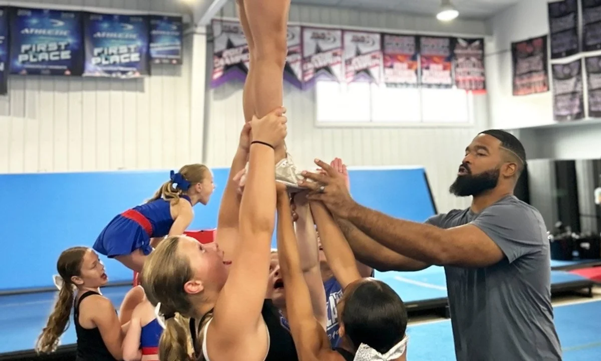 Photo of cheer group participating in a guest clinic.