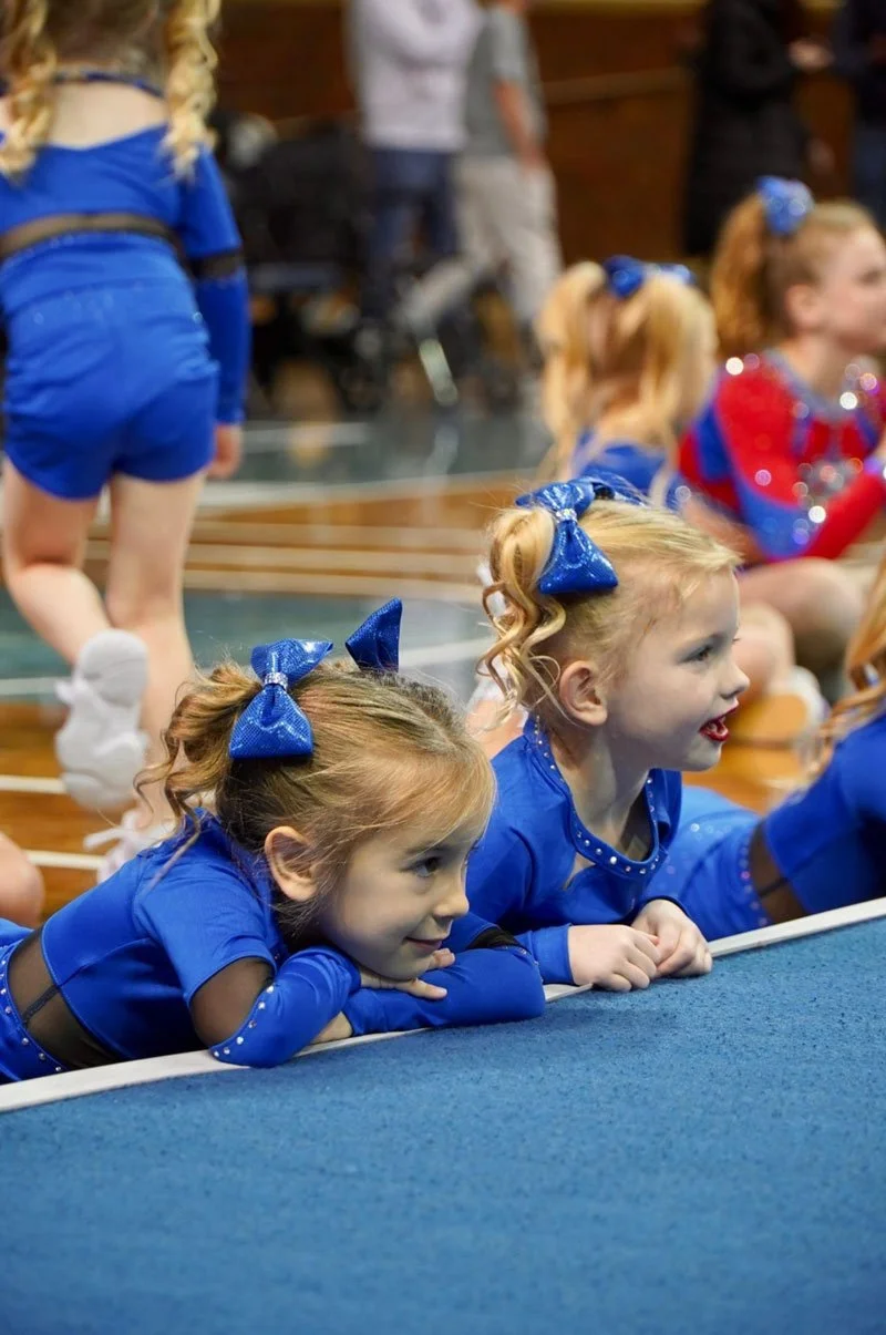 Young Dakota Spirit Prep League Cheerleaders watching a performance during the Valentine's Classic.