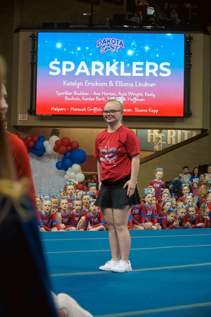 Dakota Spirit cheer ability athlete and crowd during a performance at the Sanford Pentagon in Sioux Falls, SD.