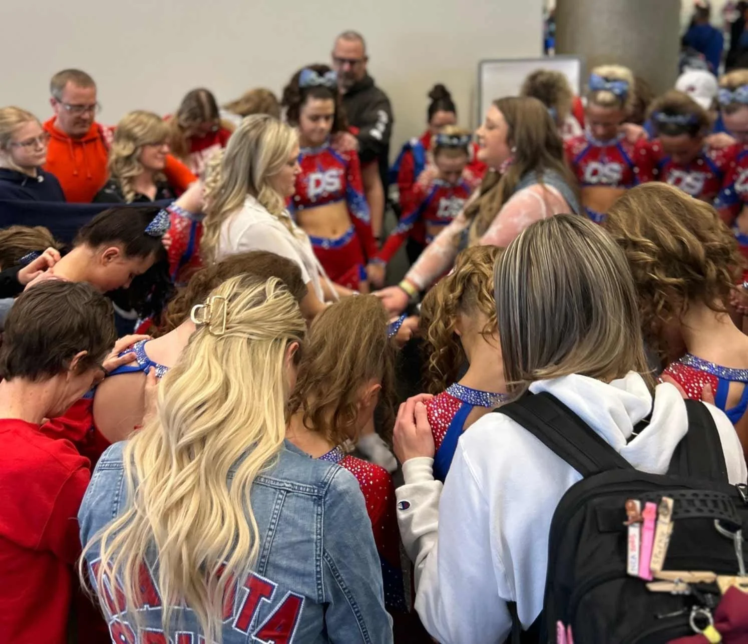 The Dakota Spirit Team participating in group prayer.