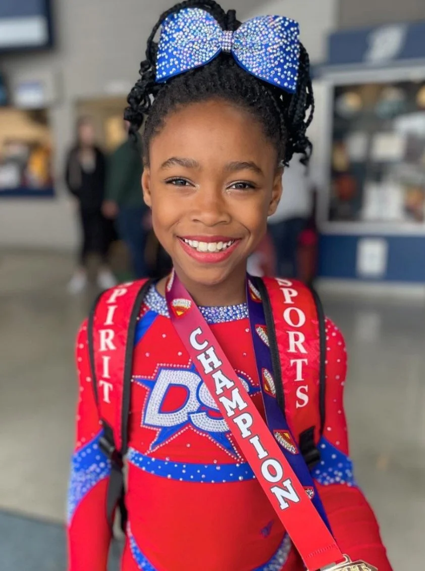 Dakota Spirit Athlete with Championship Medal.