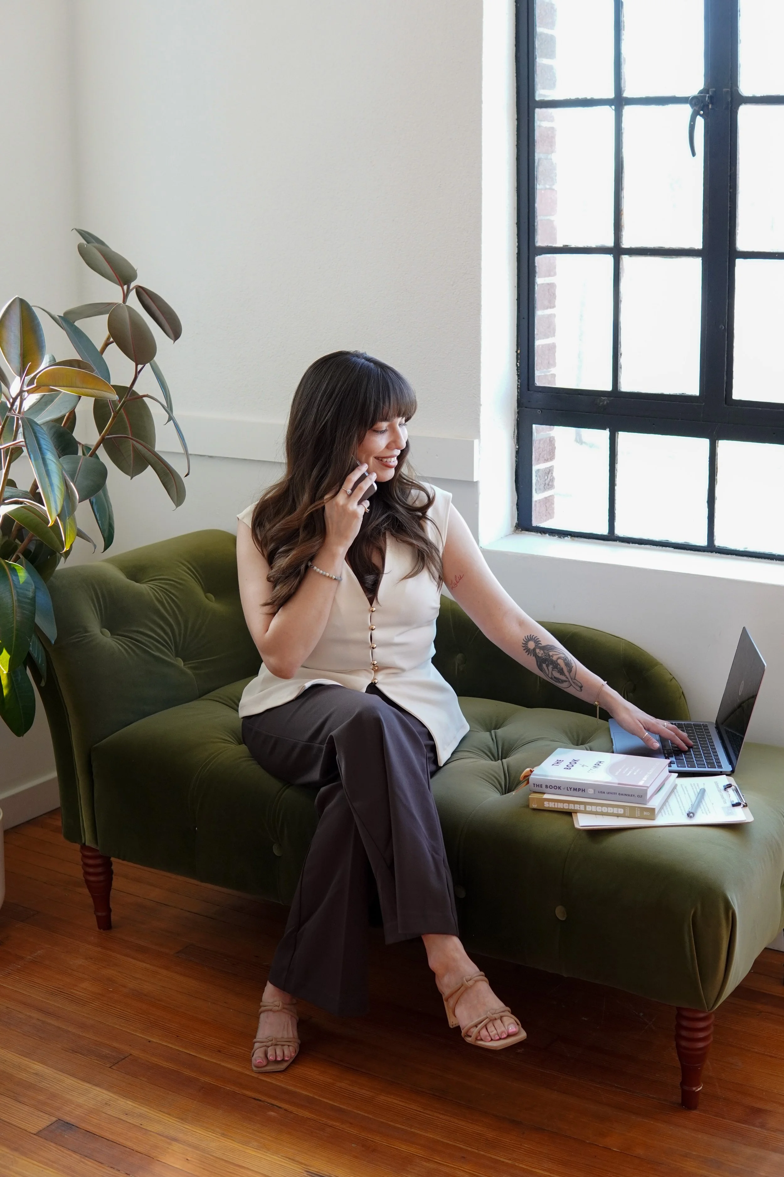 renee talking to a client on the phone, doing a virtual skin consultation