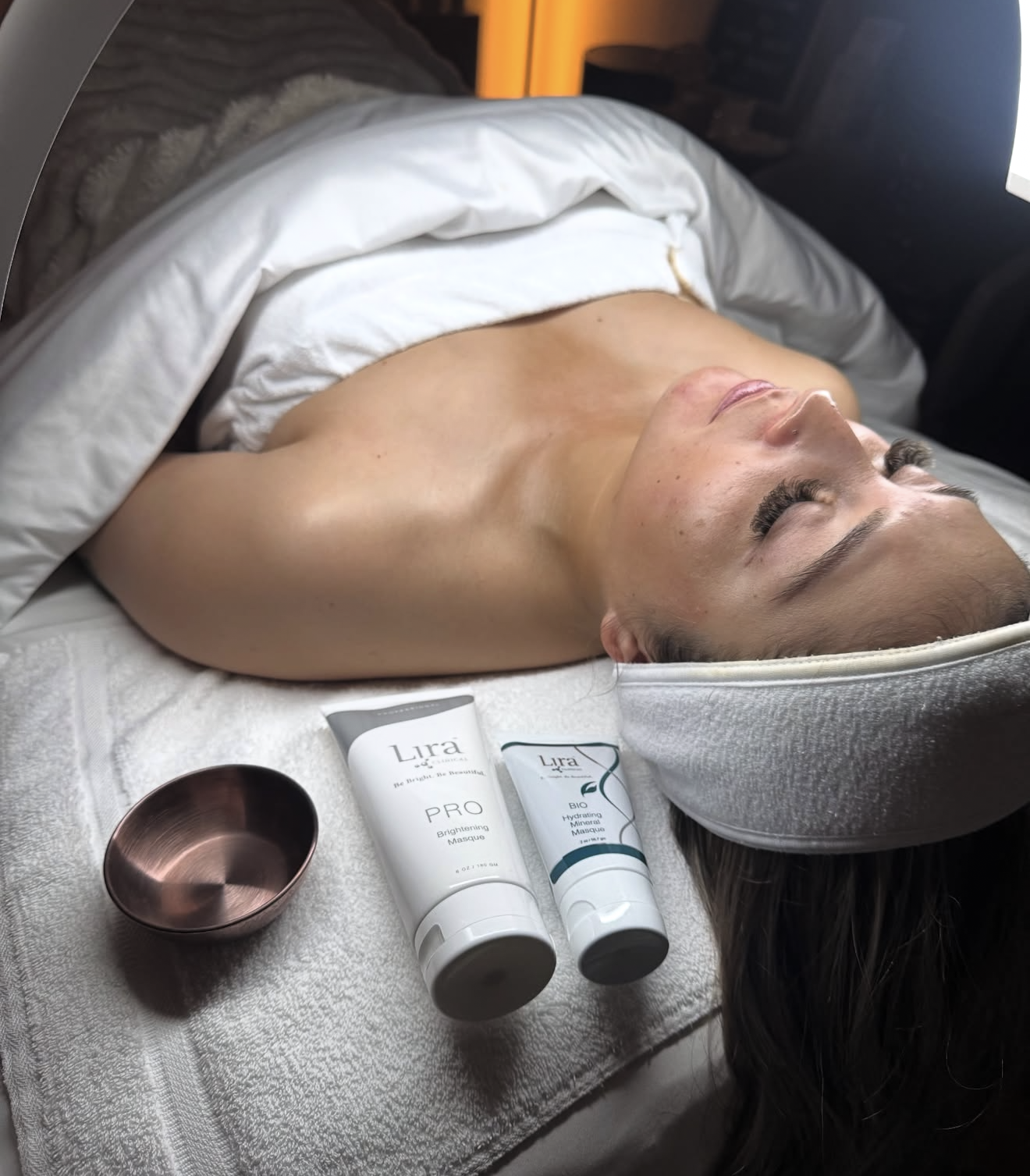 client in treatment room getting a facial