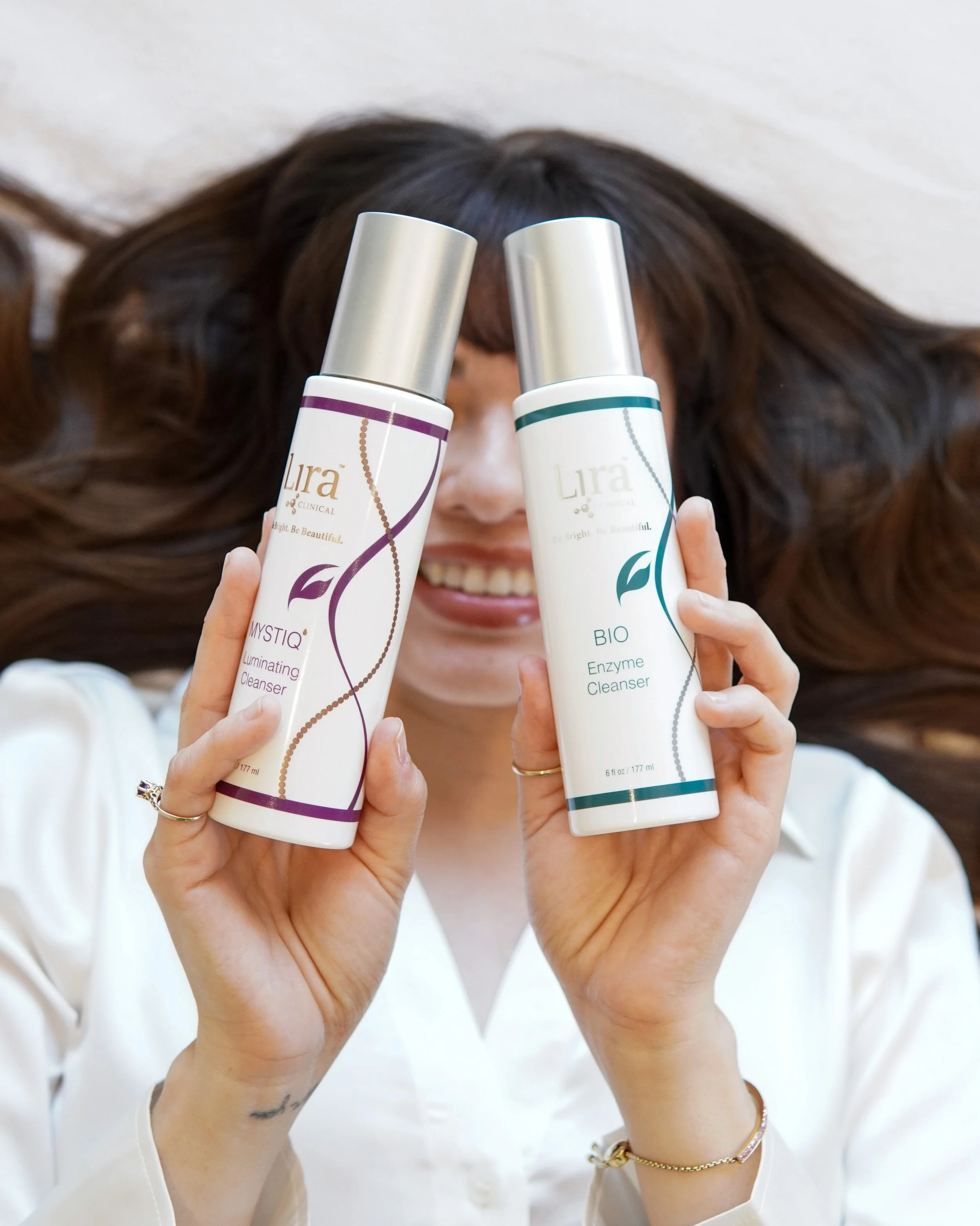 woman holding lira clinical skincare