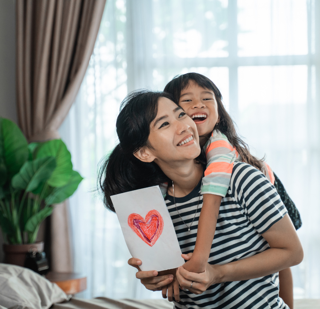 Mom with daughter who has art work