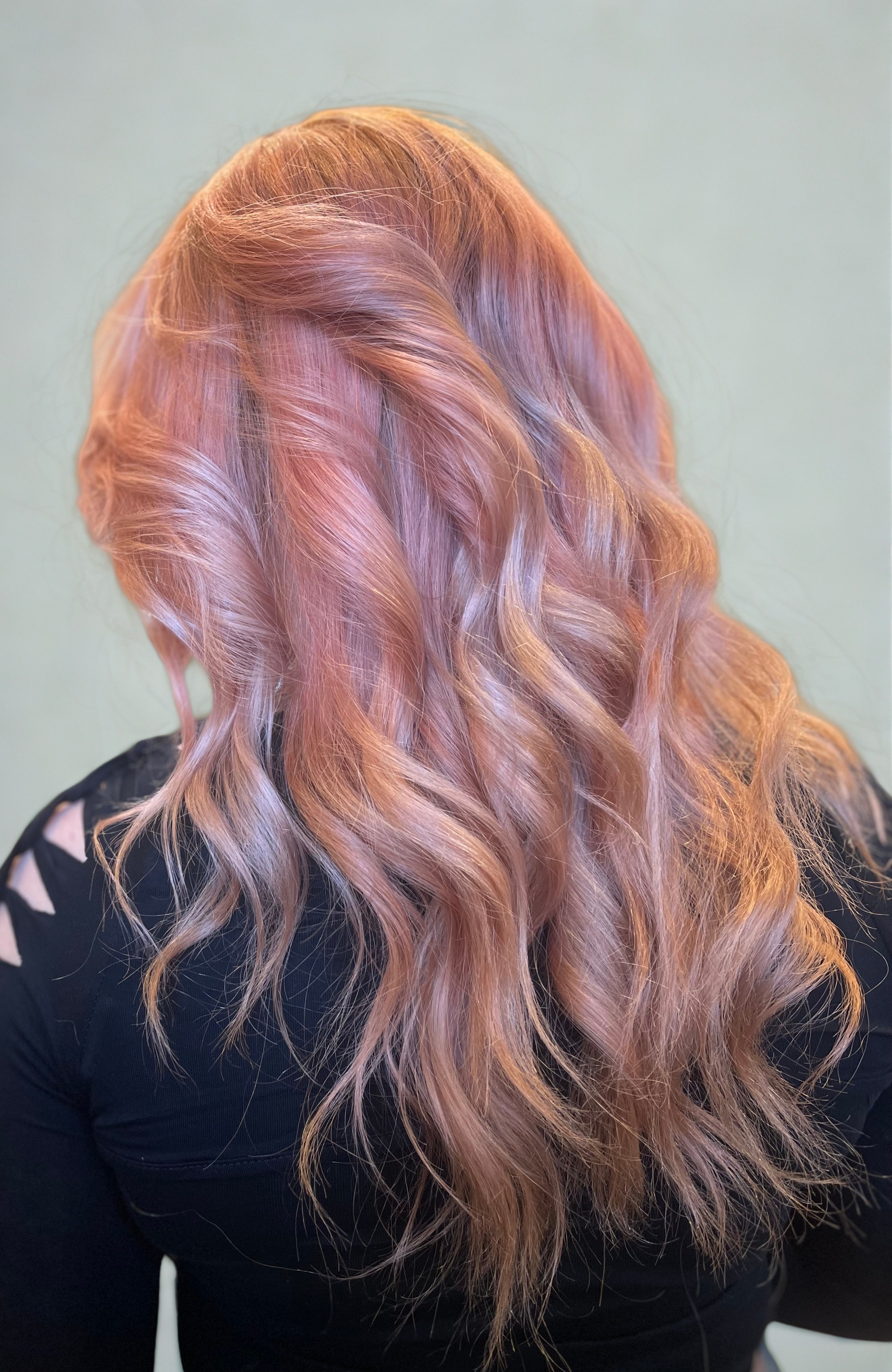 Woman with wavy, pastel pink and blonde hair. richardson tx