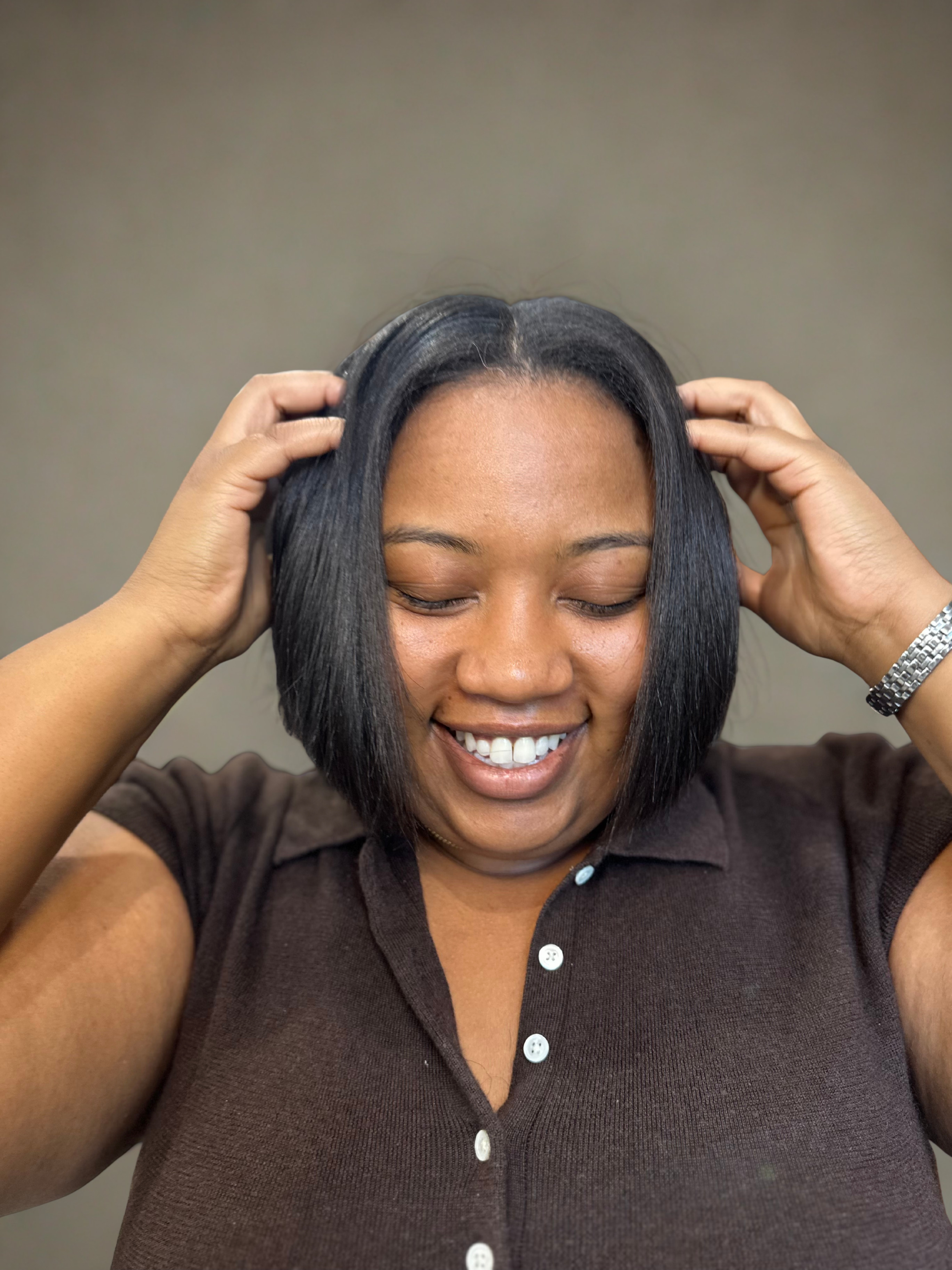 Silk press hairstyle on natural hair, smooth and shiny finish, at a Richardson, Texas hair salon