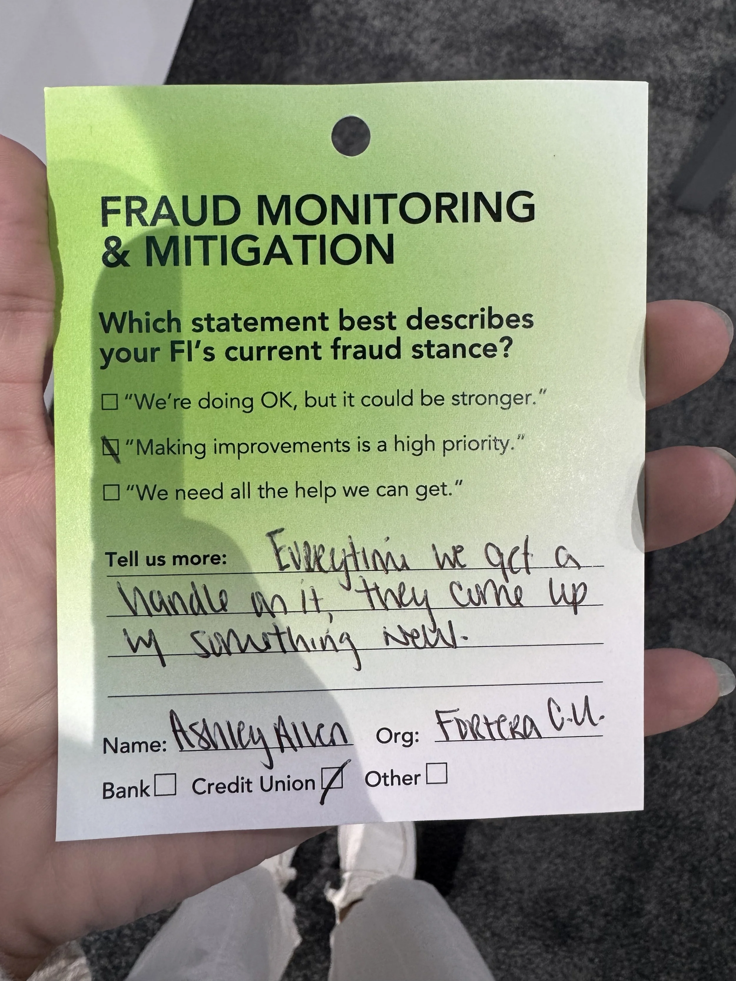 an example of one of the attendees using the provided cards to share pain points that her FI needed help with