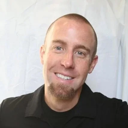 Black background with a white outline of a mountain range and a winding river at the base.