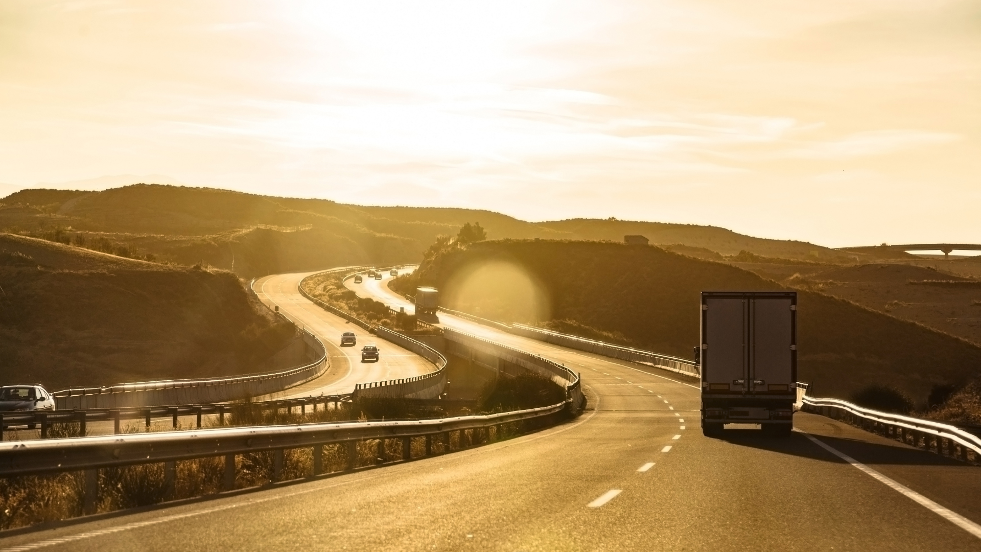 Highway at sunset representing long-term trucking insurance strategy