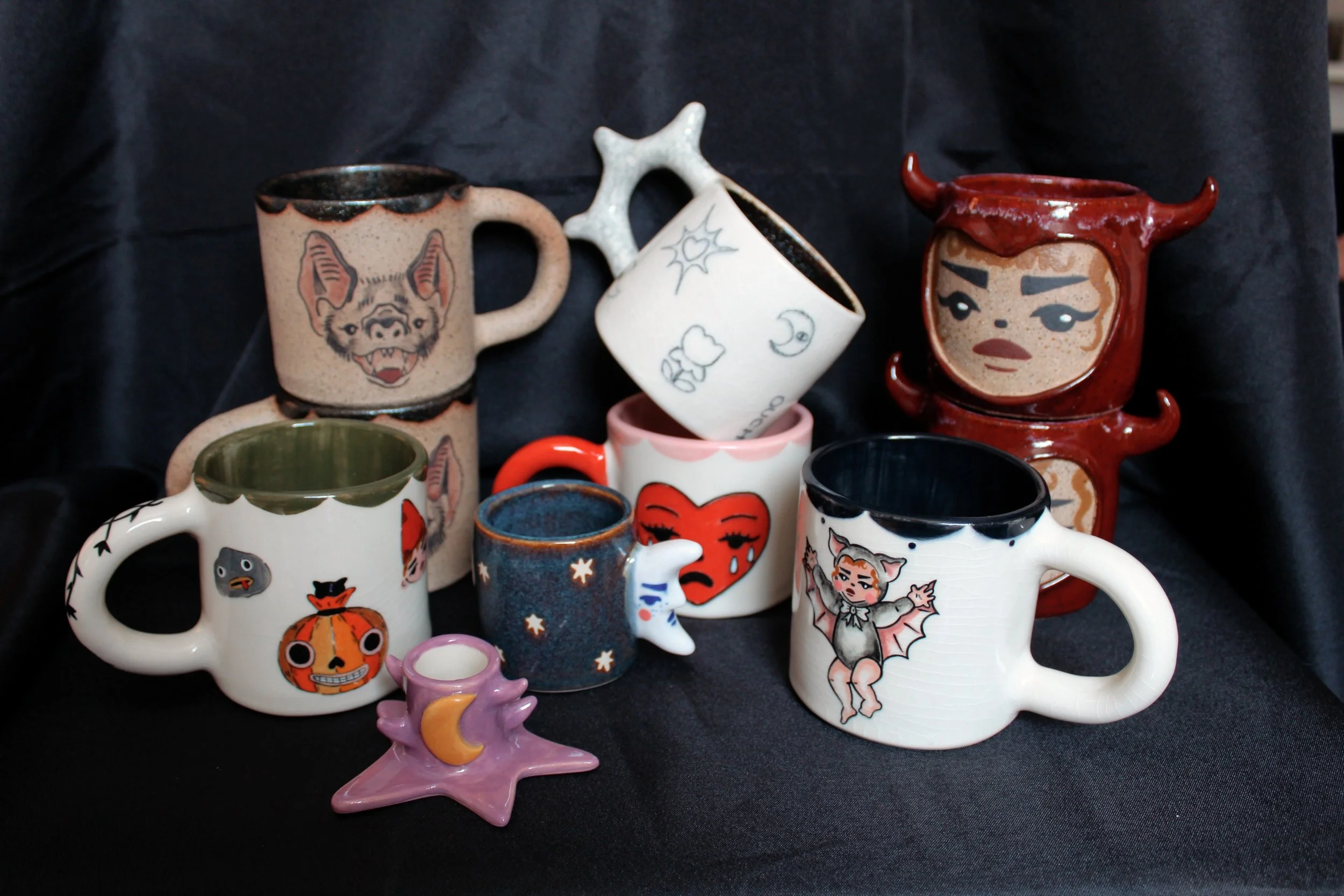 New halloween collection, including mugs and candle holders, and espresso cups.