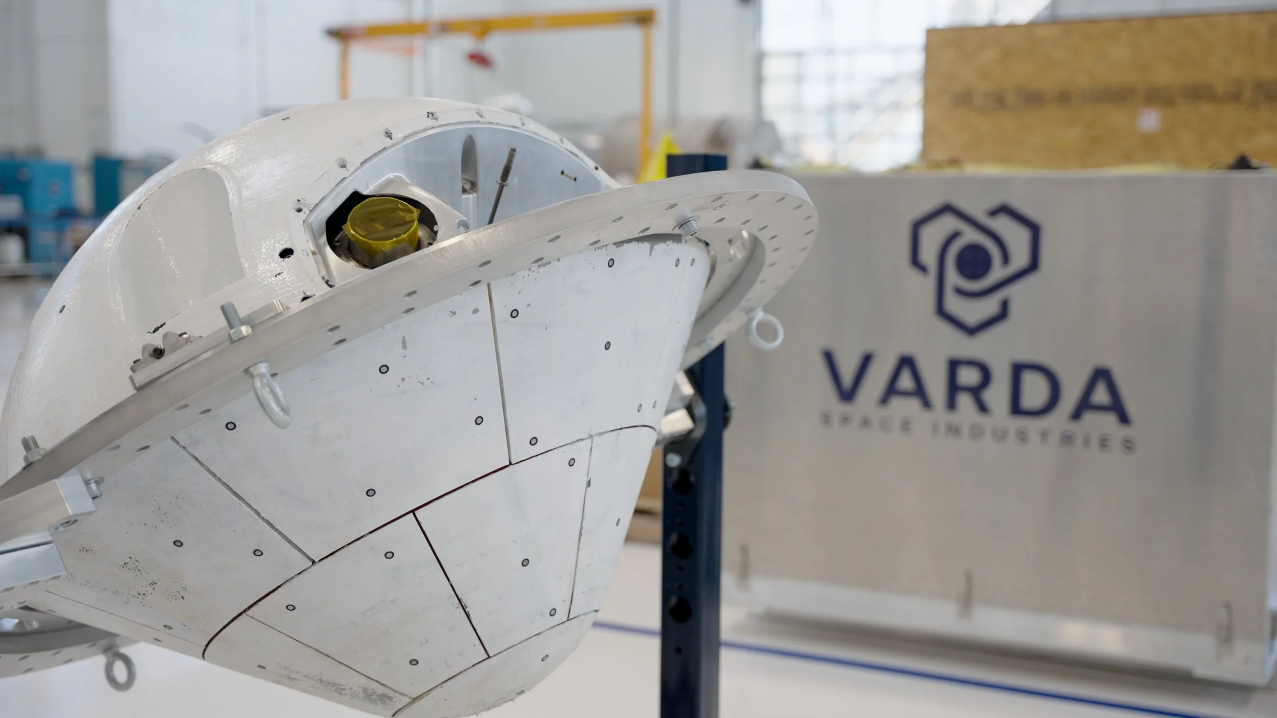 Close-up of spacecraft hardware filmed during brand film production at a space manufacturing facility.