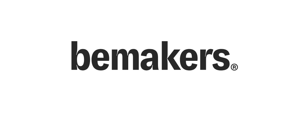 Black and white logo featuring a raised fist with the words "we are the be M A K E R S" around it.