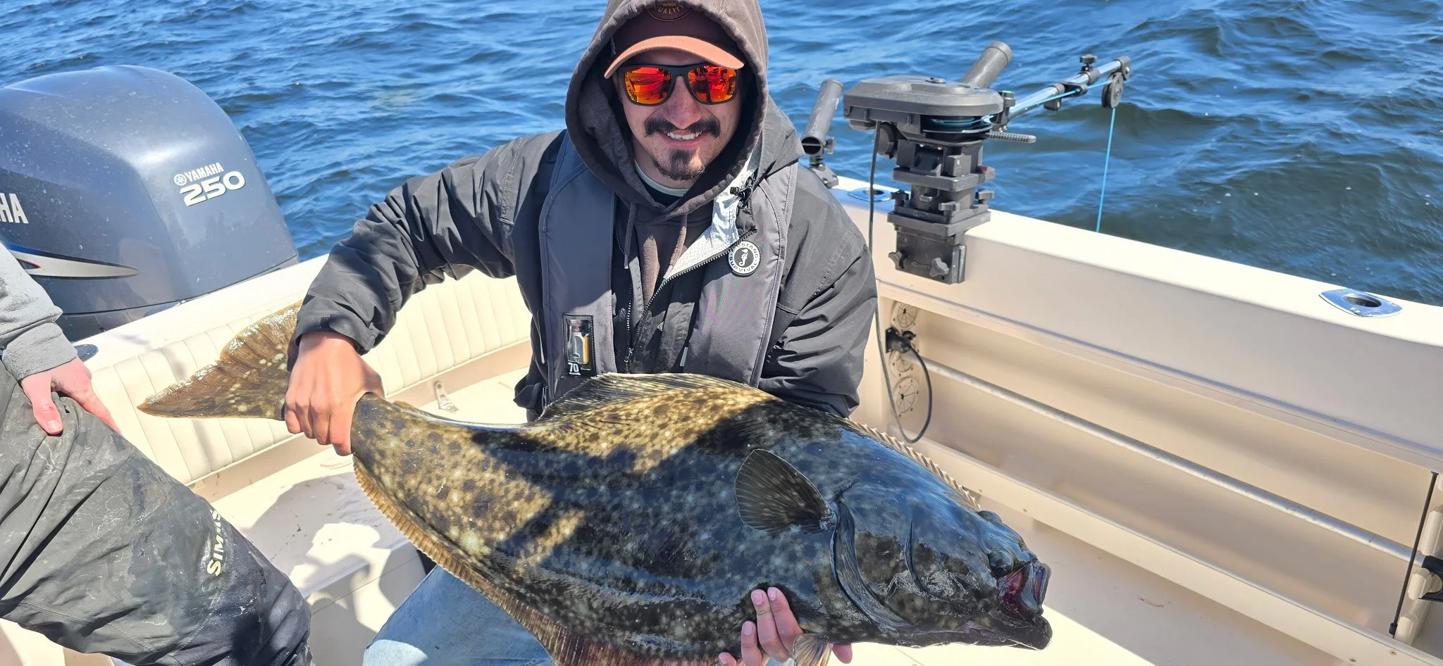 A large pacific halibut before release in Masset, Haida Gwaii