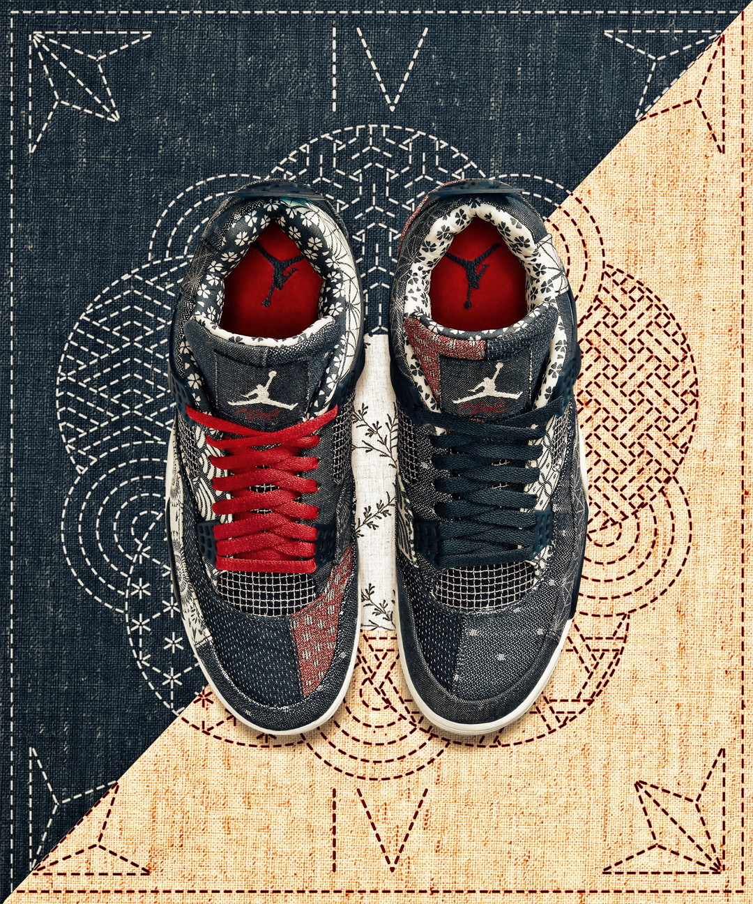 A pair of Jordan sneakers with black, white, and red design and embroidered patterns, placed on a geometric patterned mat.