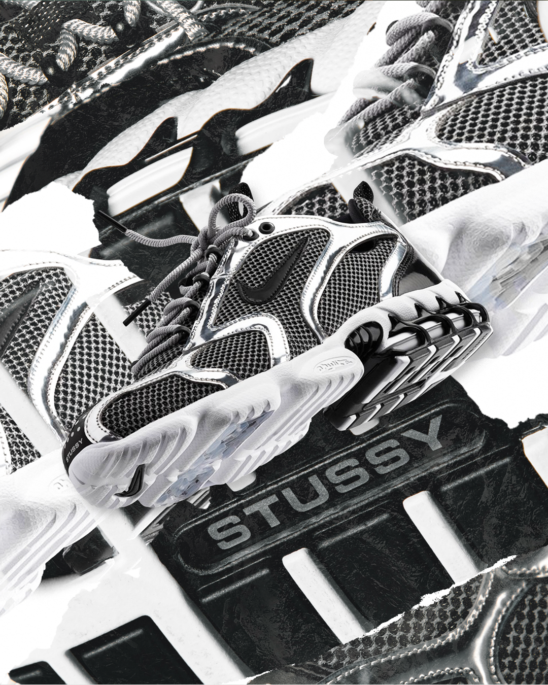 Close-up of a futuristic black and white sneaker with mesh and synthetic overlays, resting on a black box with the brand name 'STUSSY' visible.