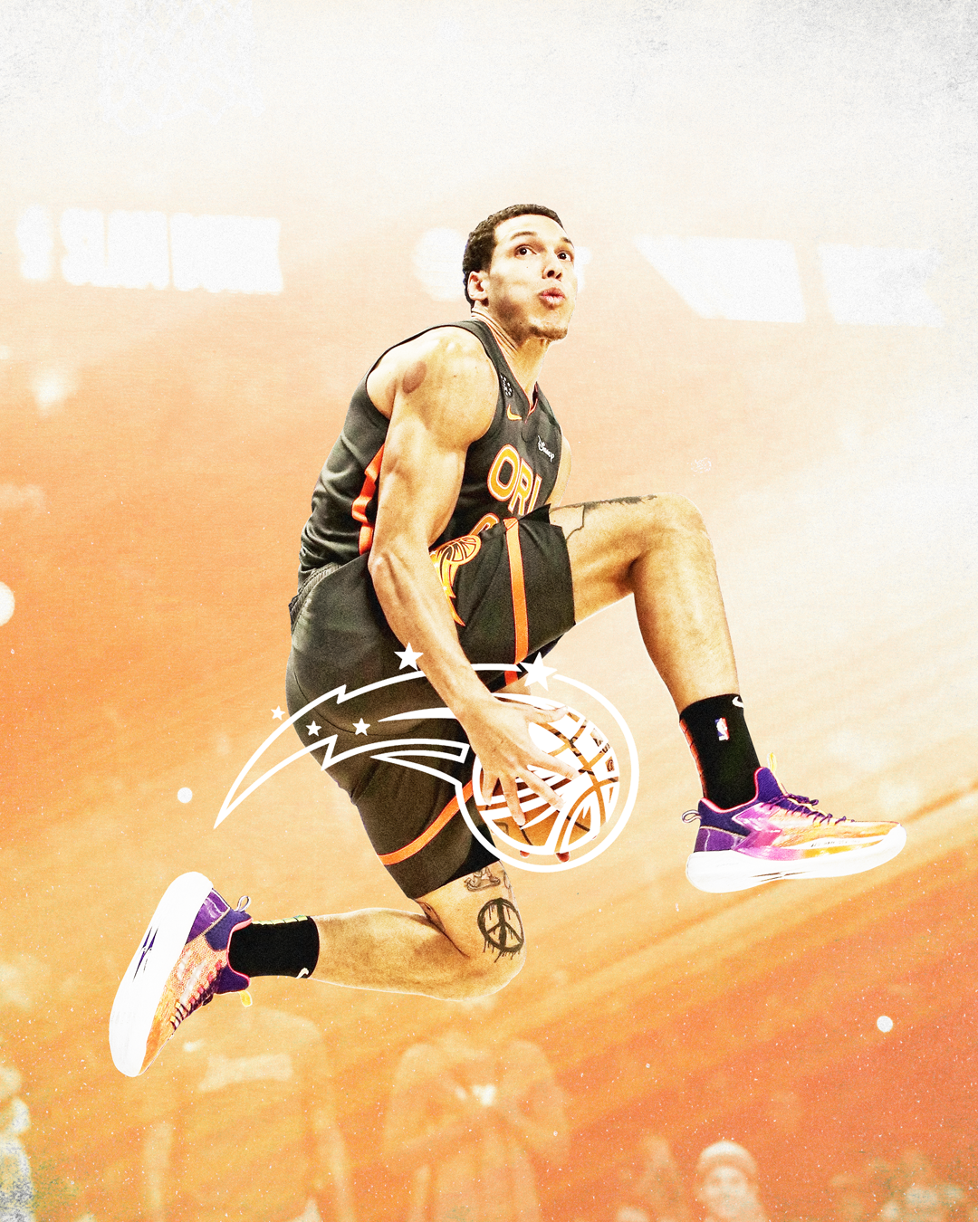 A basketball player from the Orlando Magic jumping with a basketball in his right hand during a game.