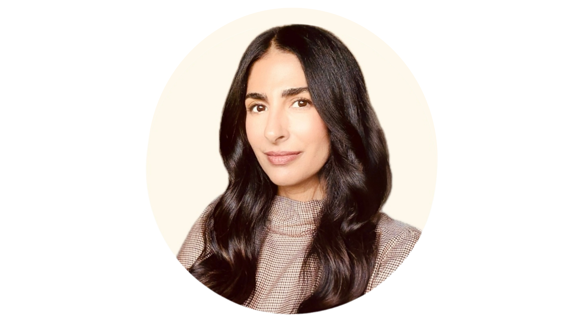 Headshot of a woman with long, dark hair, wearing a checkered top, smiling subtly against a plain background.