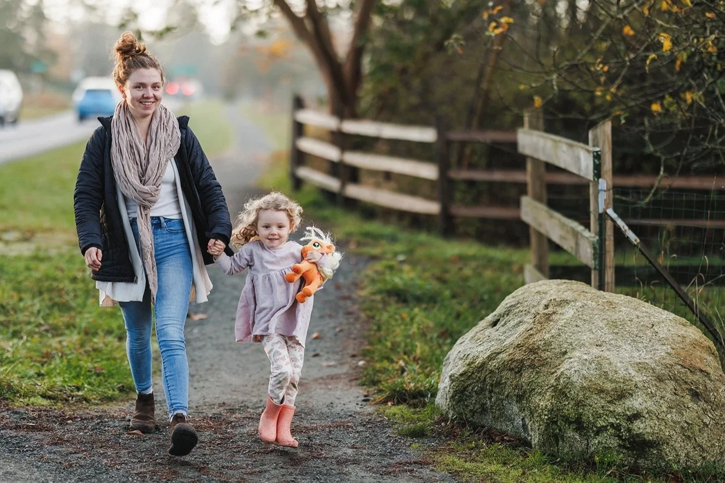 Mom holding hands with preschool child walking to school