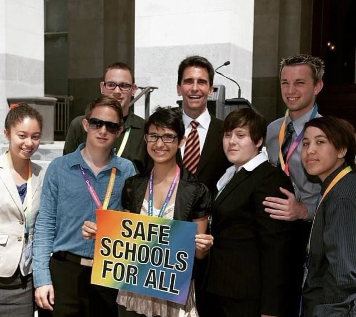 A young Adam Price appears in front of the Califonia State Capitol before testifying alongside Senator Mark Leno. 