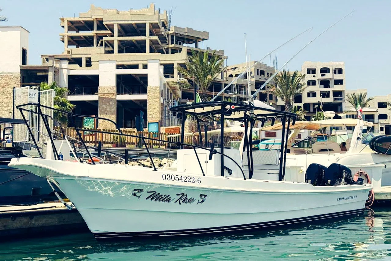 A white fishing charter boat prepped and ready at the dock. | The Marlin Hunter Fishing Charters