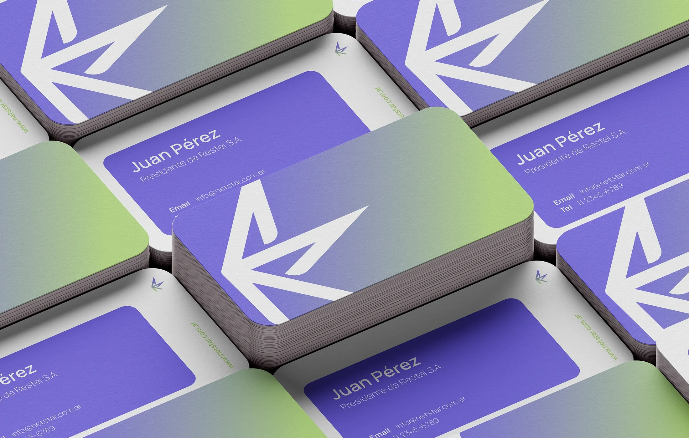 Stacked business cards featuring a white stylized star logo (Netstar's Logo), with blue, purple, and green backgrounds.