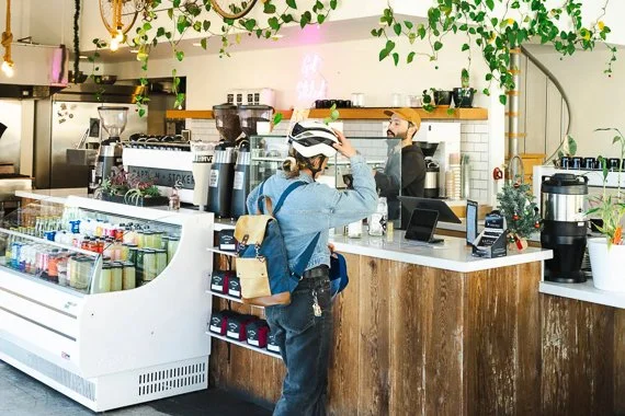 Customer at the counter at Captain + Stoker café in Monterey, California.