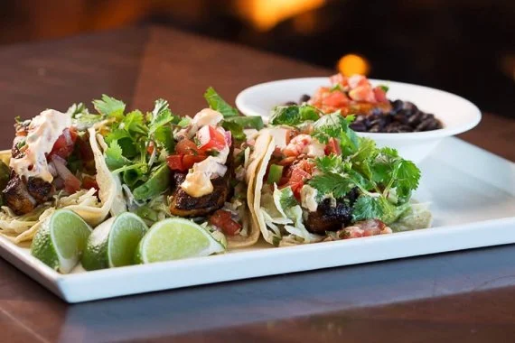 Plate of tacos and beans at Sticks bar and restaurant at Pebble Beach.