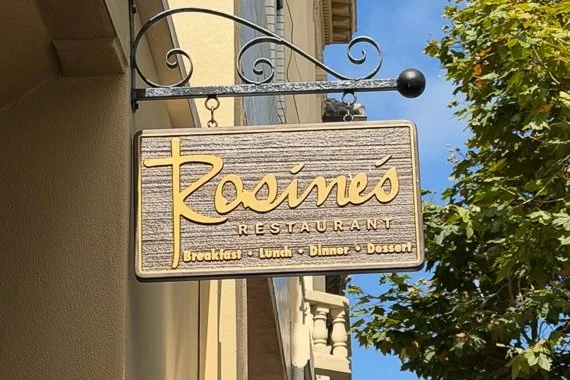 Rosine’s restaurant sign outside their restaurant in Monterey.
