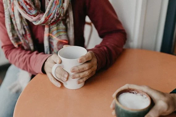People seated drinking coffee at Parker-Lusseau Pastries in Monterey, California.
