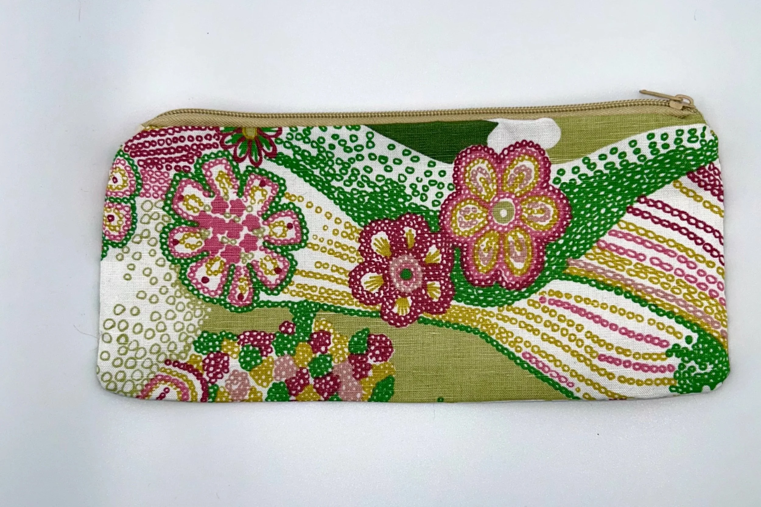 Colorful floral patterned fabric pouch with a beige zipper at the top.
