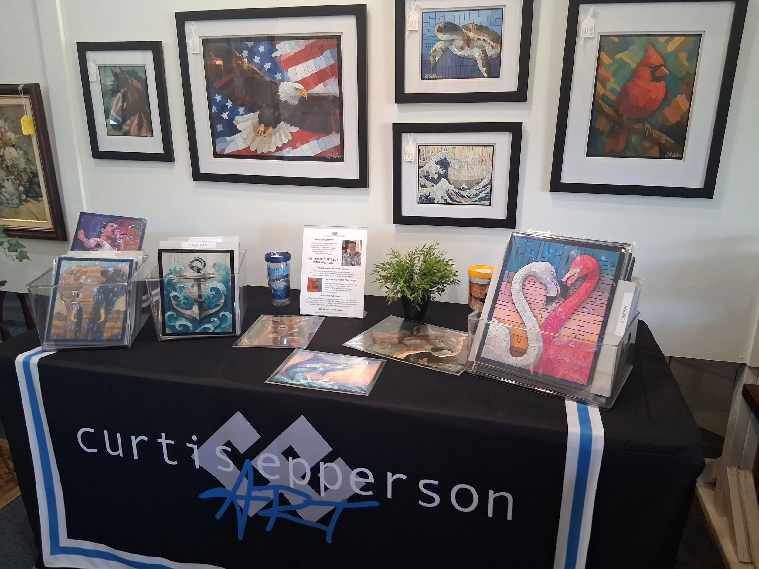 custom word art gallery with white walls, nature art, religious art, animal art, coastal art, nautical art, artworks displayed on both sides, polished floor, and large window at the end with a telescope on a stand.