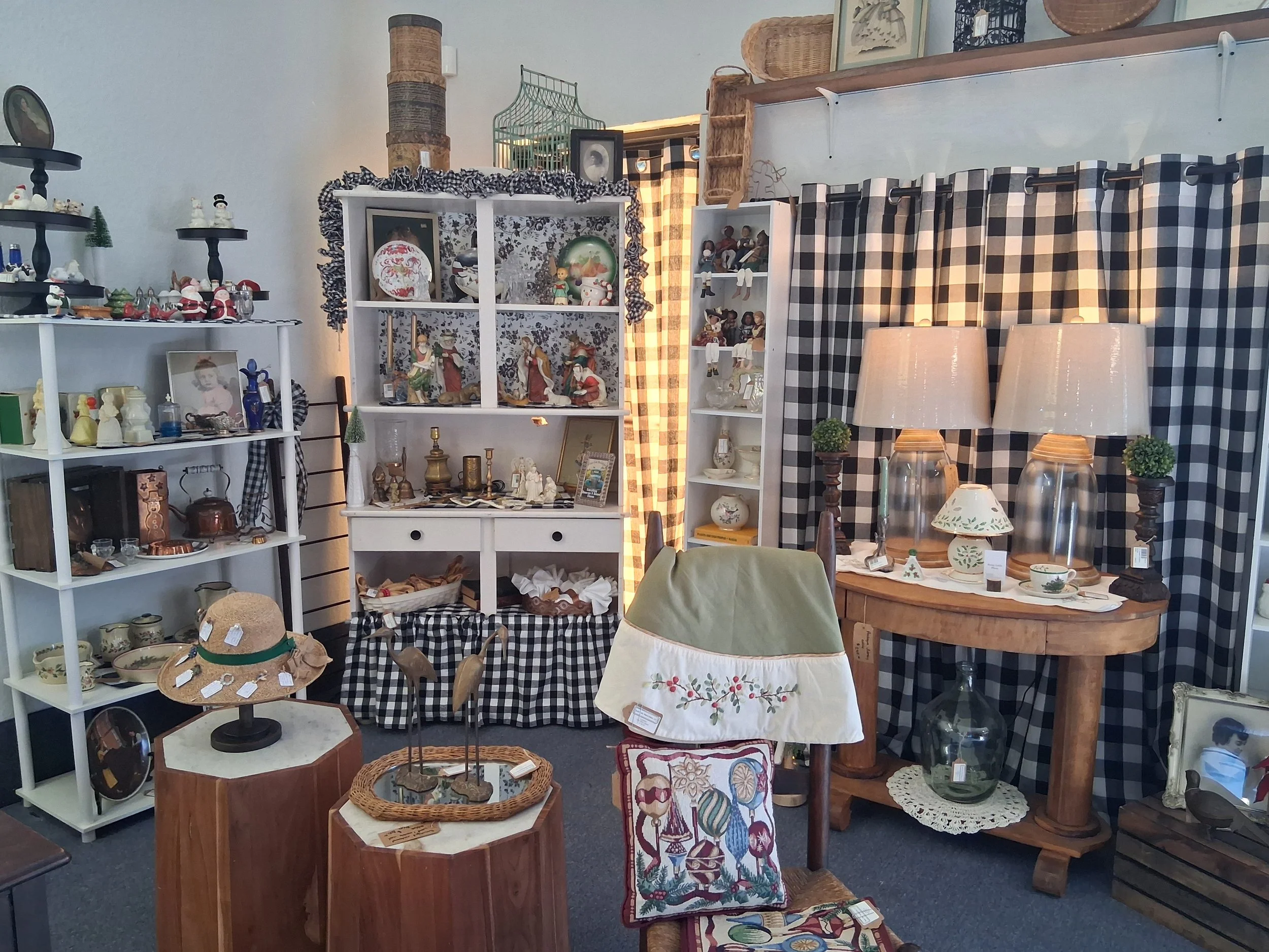 Scrabble tiles arranged in the shape of a cross spelling the word 'PLANE' with 'M' in the center.