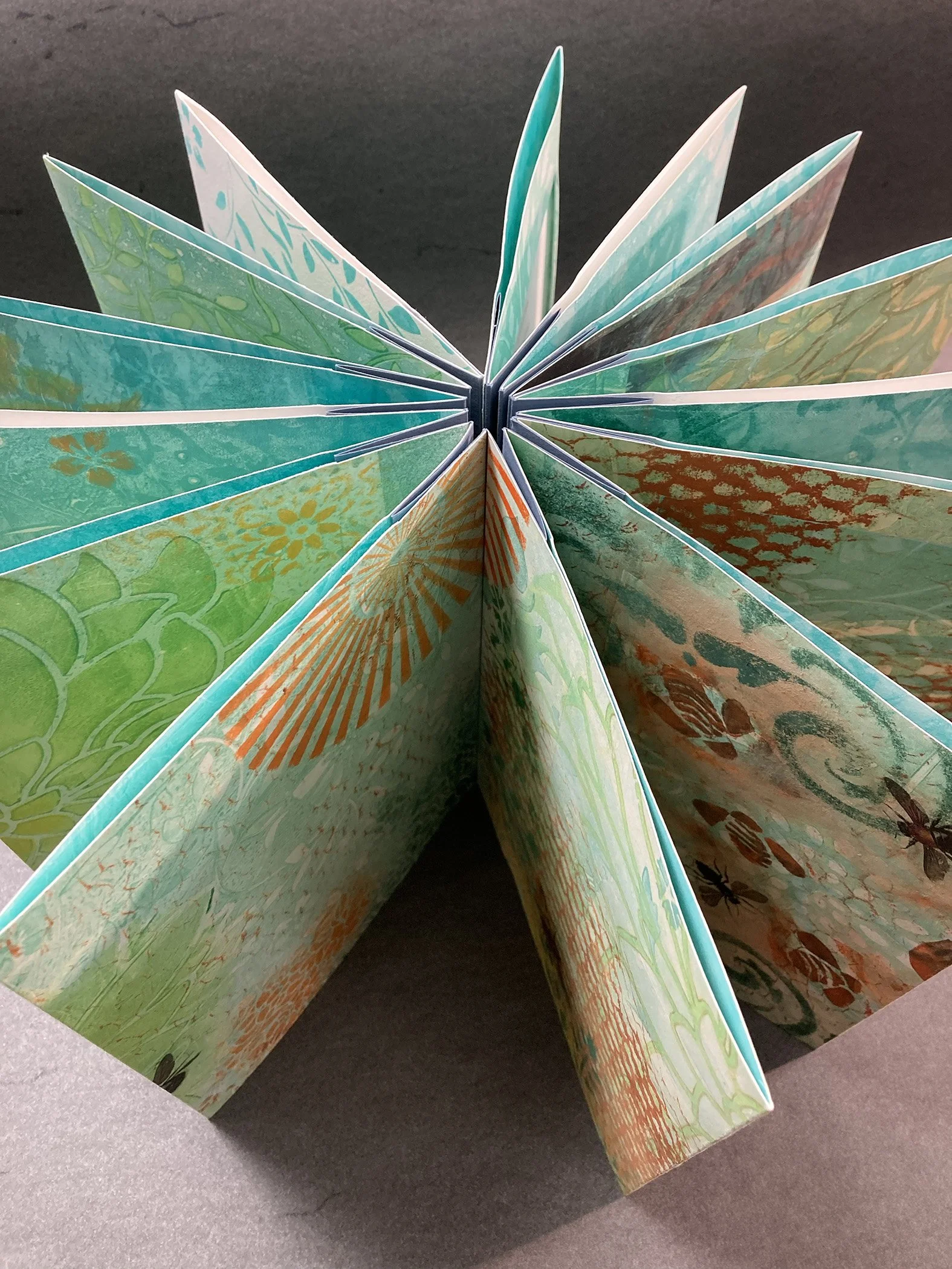 “Telling the Bees” - An excerpt from “Telling the Bees” by John Greenleaf Whittier was the inspiration for this book which is a concertina accordion binding housed in a clamshell presentation case of hand-stenciled book cloth. The pages are combinati