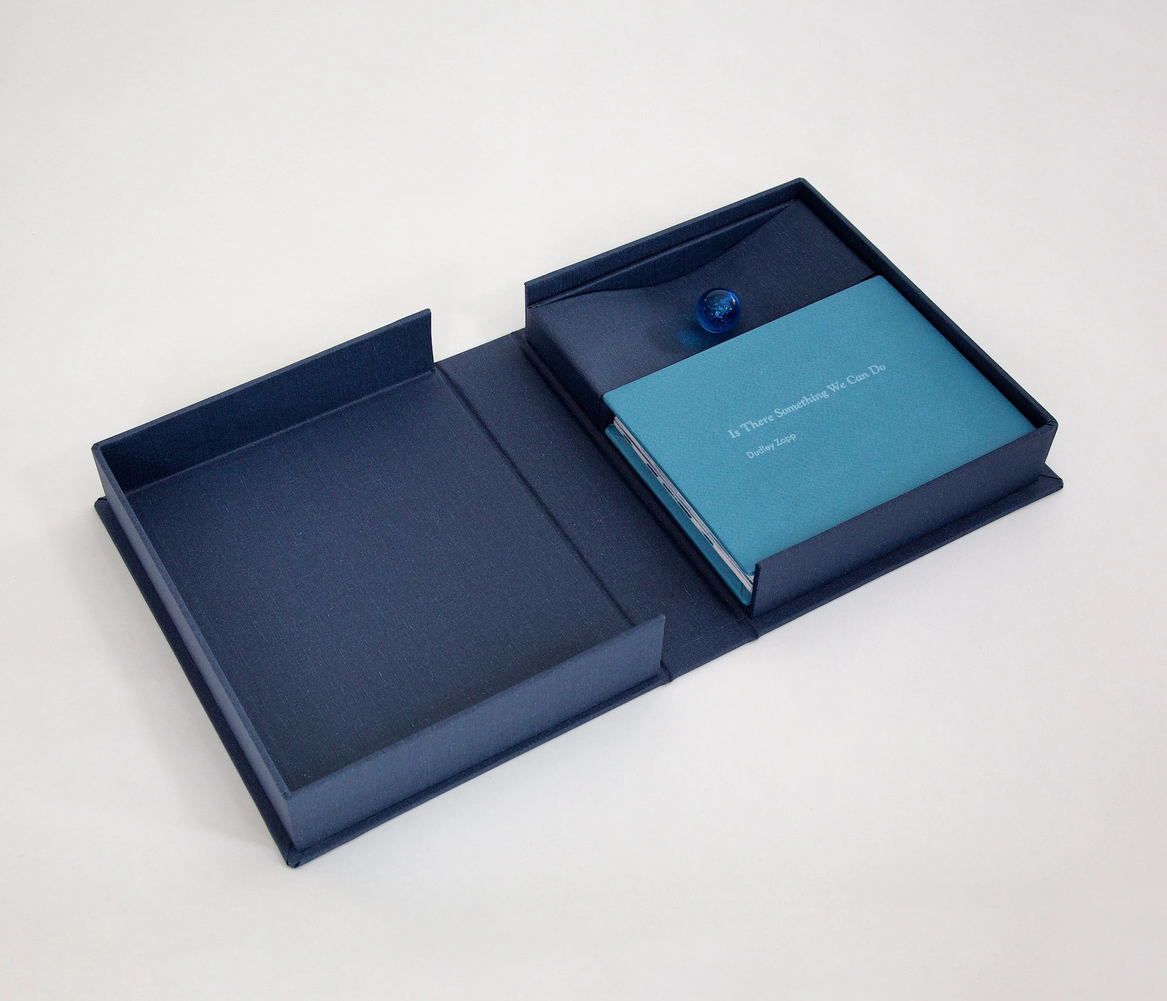 The Blue Marble Book: Is There Something We Can Do, 2017.
Star accordion book, printed offset with letterpress cover. Dimensions book closed: 5.5 x 7.25 x 1.25 inches. Clamshell box closed: 8 x 9.75 x 2 inches.
