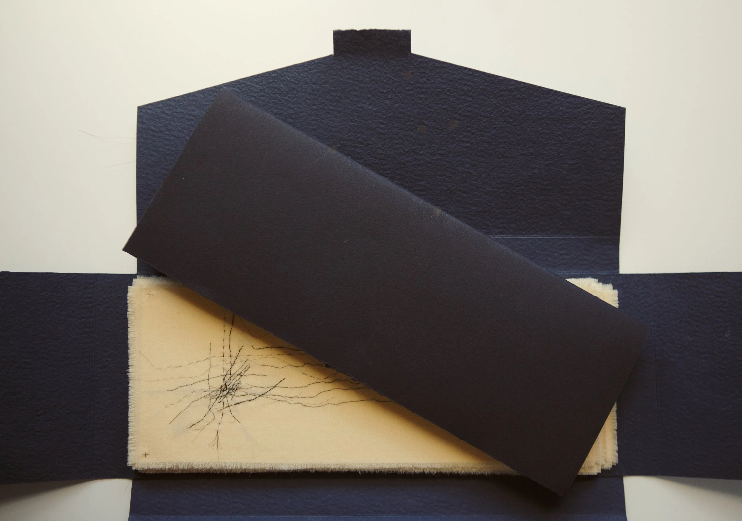 Filament - Opened folio with one hair drawing peeking out