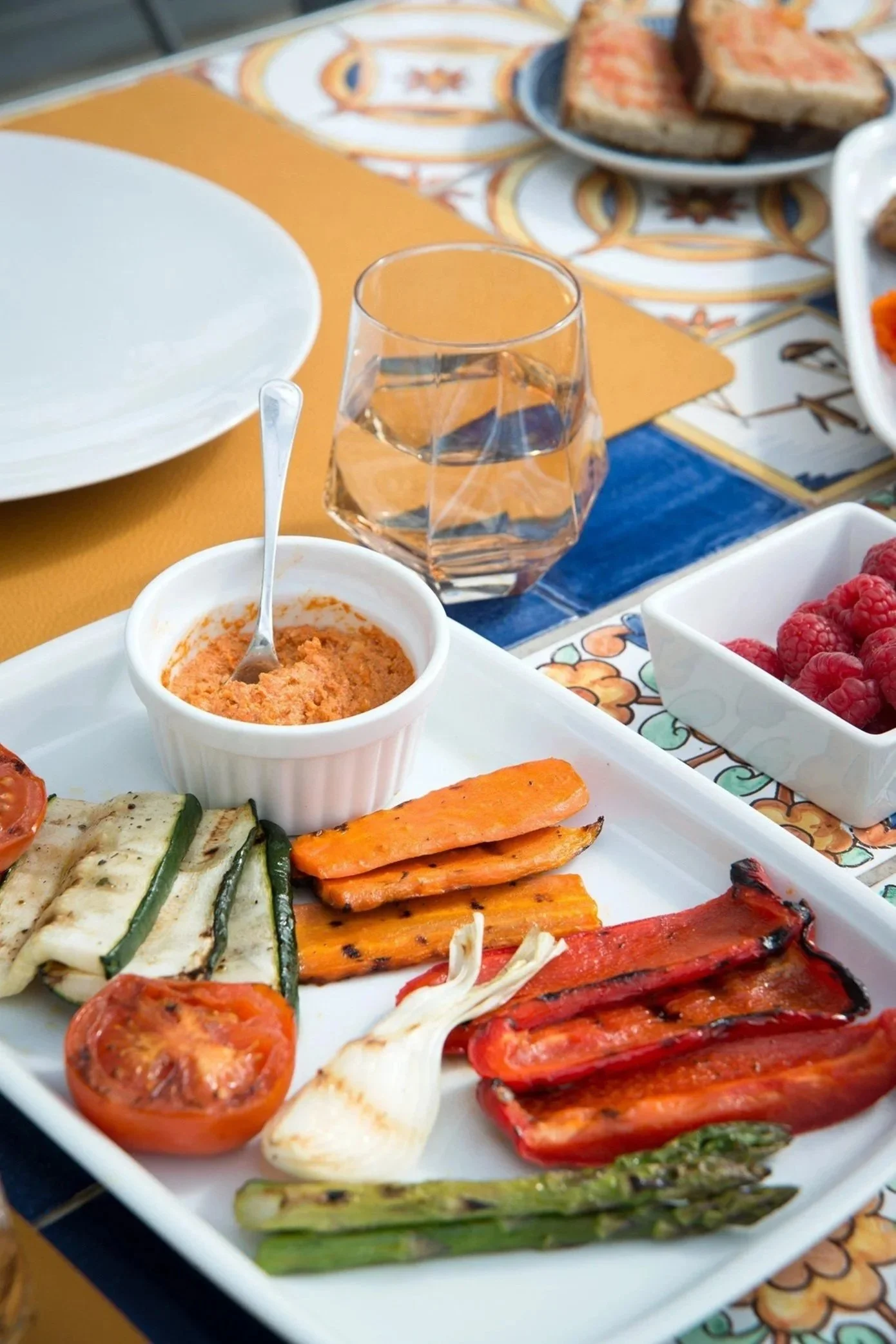 Breakfast at Casa de l'Albada. Mornings unfold on the terrace, where sea and mountain views meet the scent of fresh coffee and warm bread. Each stay includes a complimentary continental breakfast—simple, fresh, and thoughtfully prepared.