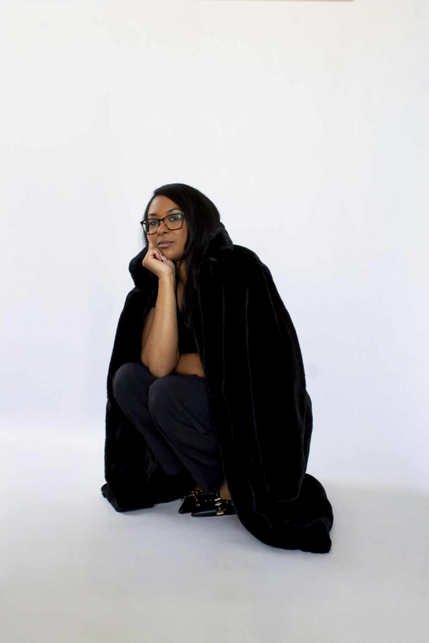 Realtor with white backdrop branding shoot, winter time, vogue pose. branding shoot for real estate agents. branding shoot for entrepreneurs. branding for business owners.