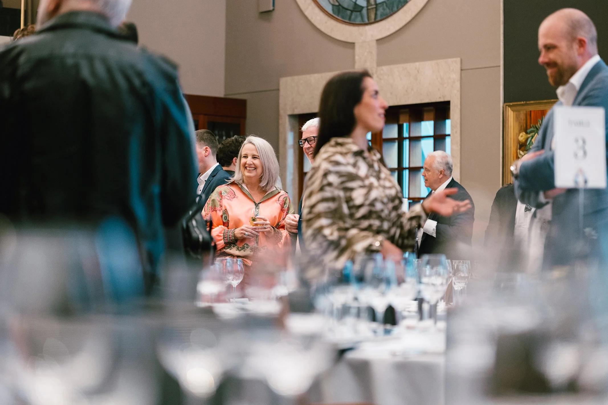 Group of professionals enjoying conversation at a business event